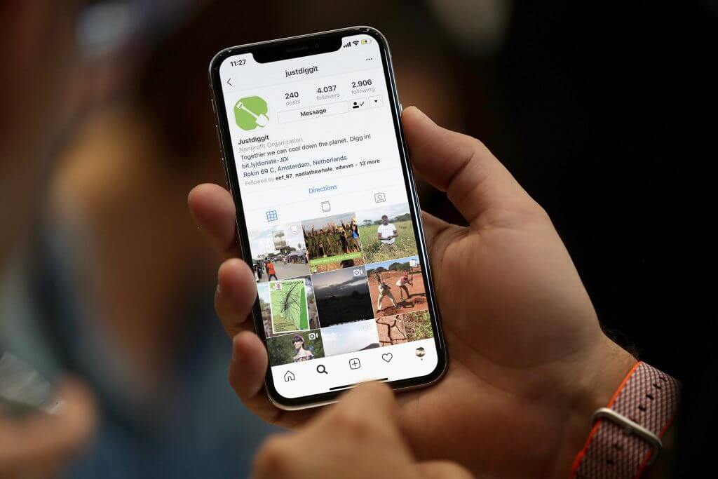 5_awareness campaigns_communication_what we do_Justdiggit_Phone_Hand_Mockup_social media_instgram_profile